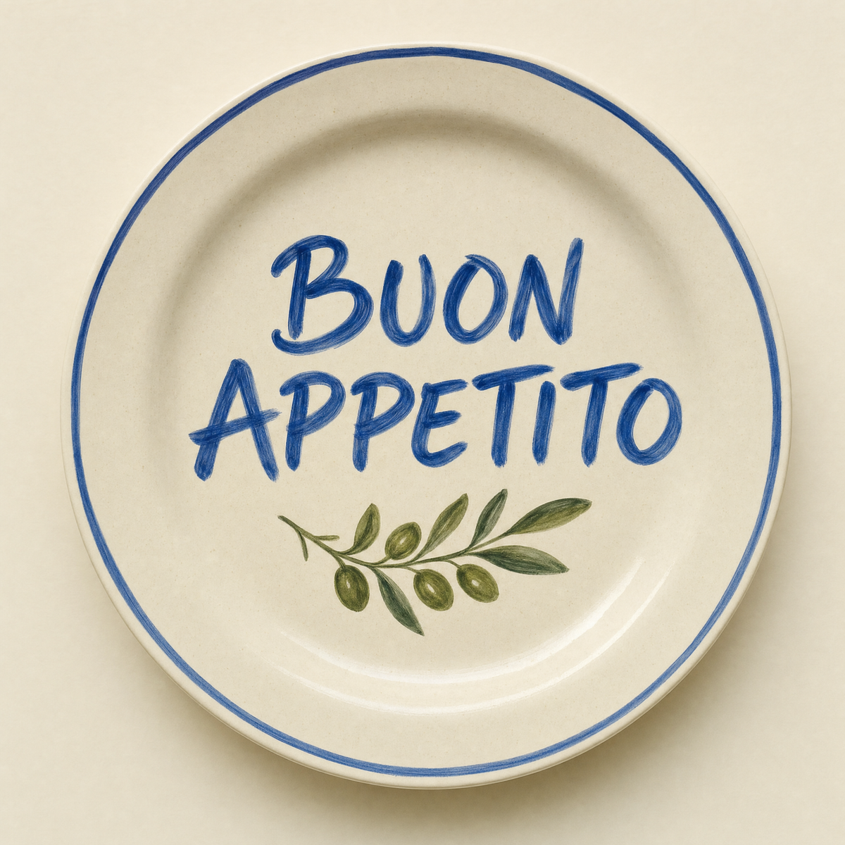 Ivory ceramic dinner plate hand-lettered Buon Appetito in cobalt with an olive sprig