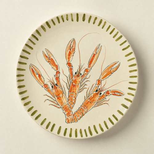 Ivory ceramic dinner plate hand-painted with a tangle of langoustines and an olive brush-stroke rim
