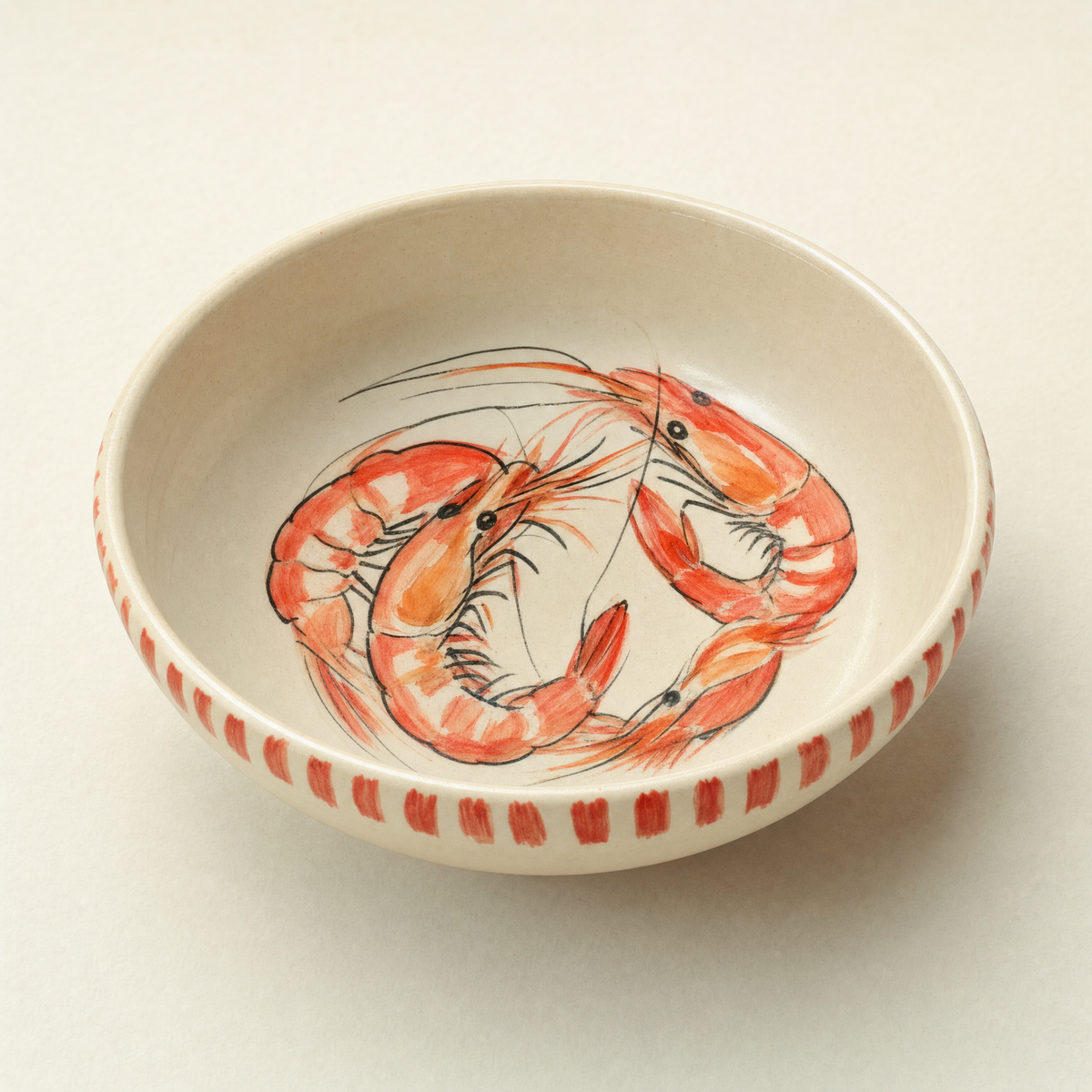 Deep ivory ceramic supper bowl hand-painted with two curled prawns and a coral brush-stroke rim